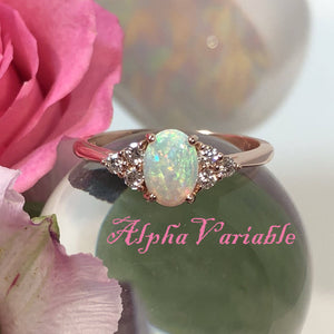 Rose Gold Opal and Diamond Engagement Ring on a Crystal Ball with Pink Rose